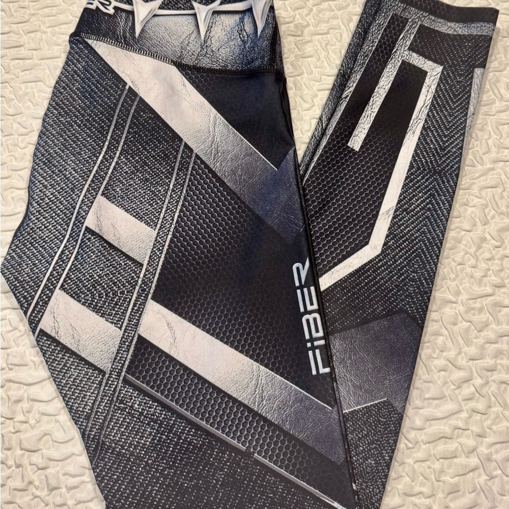 Geometric fiber leggings in black and gray. One size fits most.